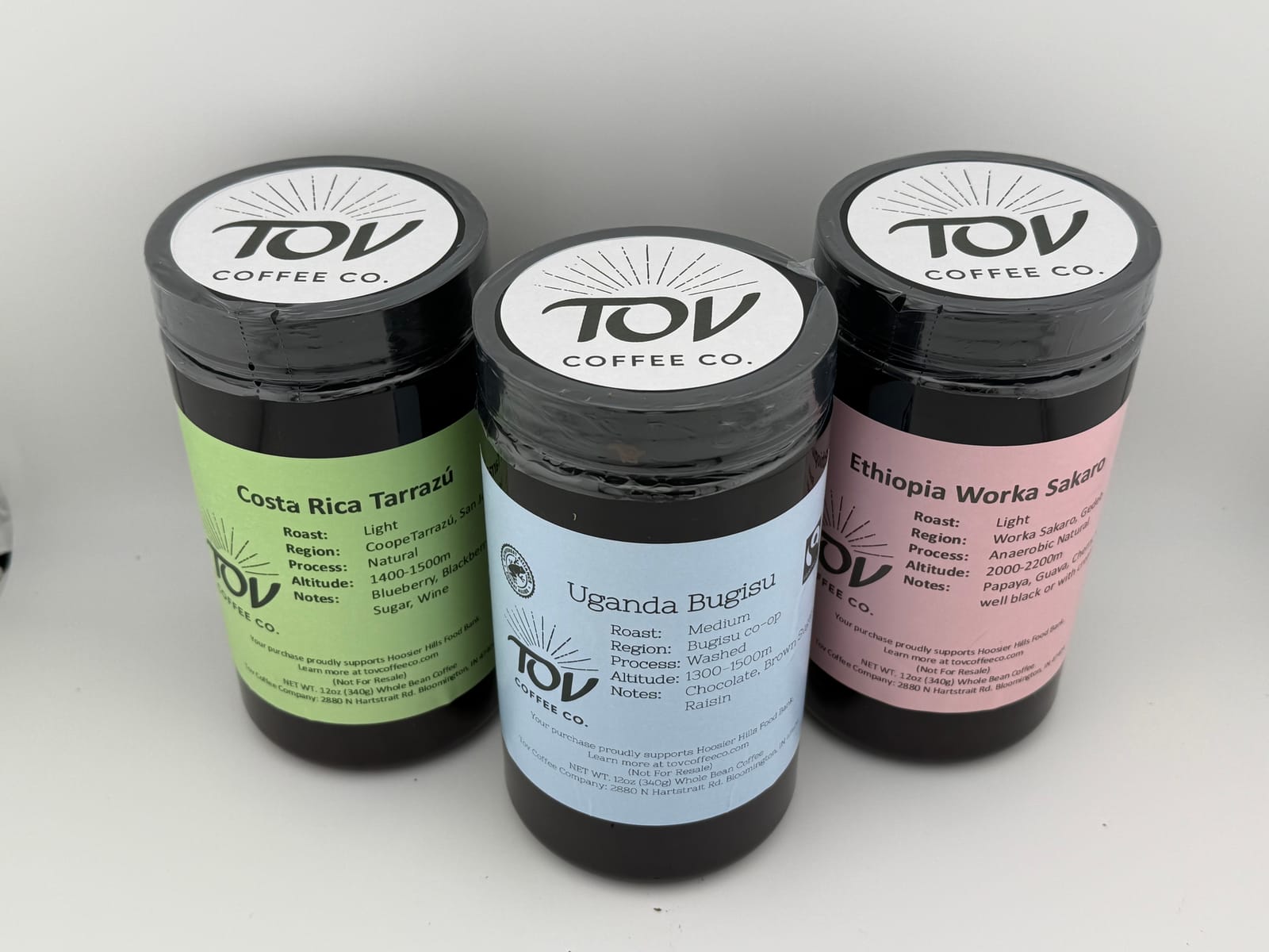 Three jars of Tov Coffee Co. single-origin coffee — Costa Rica, Uganda, and Ethiopia